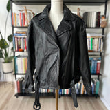 90s Wilson’s leather jacket with feather cutout detail on back.
