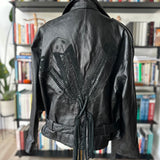 90s Wilson’s leather jacket with feather cutout detail on back.